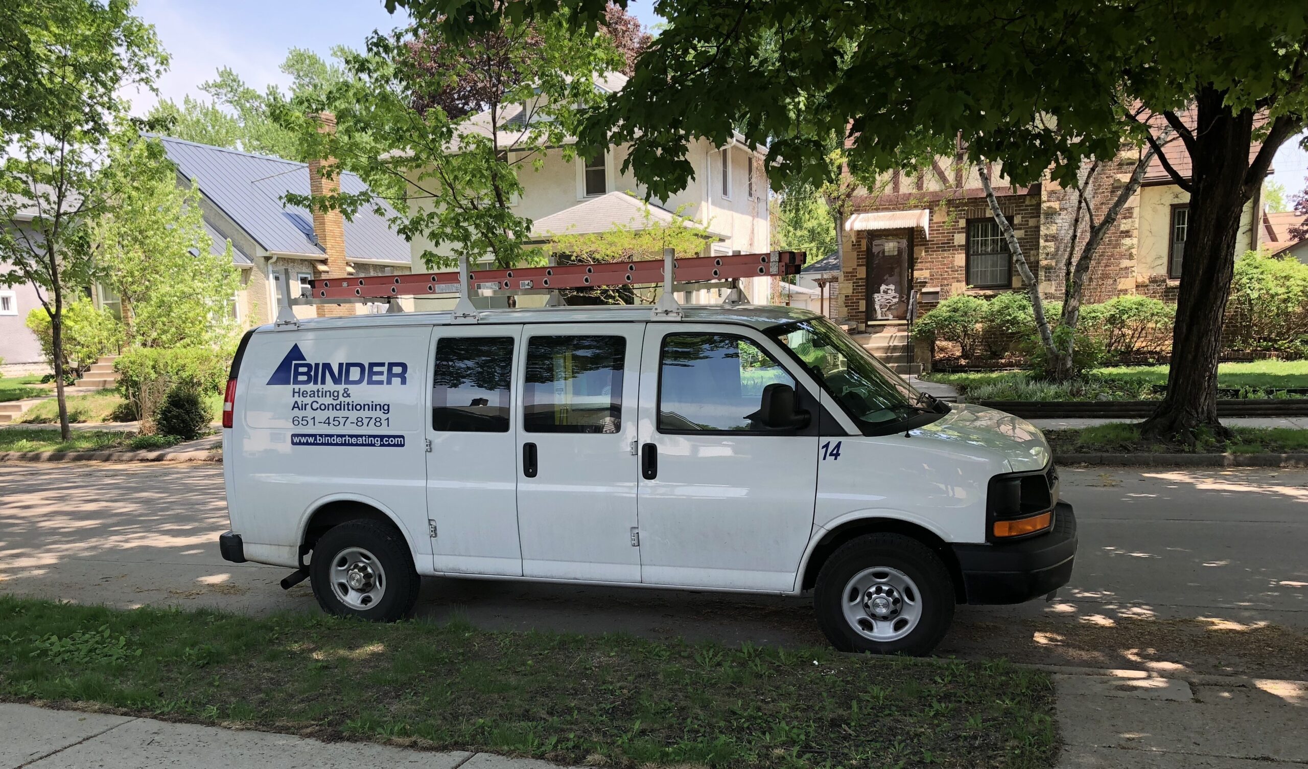 Binder HVAC service van parked outside residential St. Paul homes