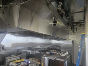 Binder Heat & Air installing commercial kitchen ventilation installation at Tono Pizzeria & Cheesesteaks North Loop